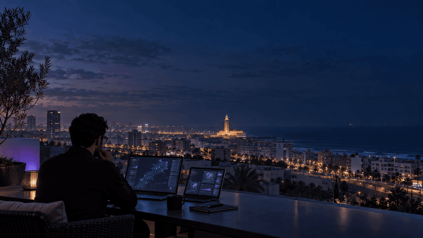 Person viewing web-intelligence dashboards from a Casablanca rooftop at night